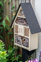 A homemade insect house, with lengths of canes for beneficial solitary bees as well as ladybirds and wasps.