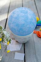 Making paper lanterns - Apply a single layer of tissue paper, using the PVA glue, overlapping the pieces cut in to rough squares 3-4cm in size