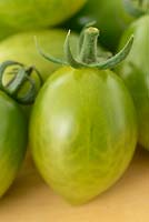 Solanum lycopersicum 'Green Envy', Tomato F1 Hybrid. Syn. Lycopersicon esculentum. Picked friut  