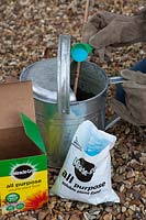 Mixing general purpose soluble fertiliser in watering can