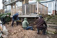 Urban garden makeover, Richmond with ACRES Gardens, digging trench for retaining wall foundations