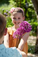 Children with Allium 'Purple Sensation