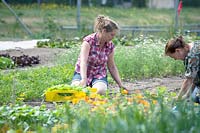 Jessica Zwartjes and volunteer planting in the communal garden.