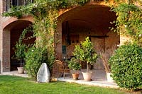 Containers under arches. Govone. Garden project by Anna Regge. Piemonte, Italy.
