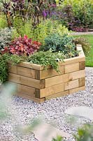 Summer planted wooden raised bed