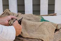 Cutting hessian sack for lining of plants