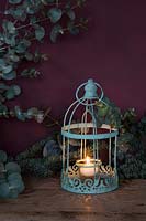 Decorative Christmas lantern with Eucalyptus and Pine cones