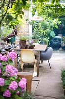 Outdoor living with table and chairs. Hackney, London 