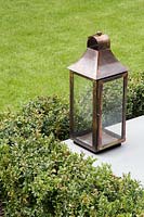 Copper lantern on patio