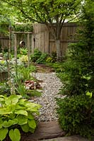 Garden with Hosta, Heuchera and rustic Chime 