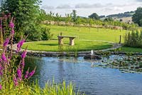 The garden integrates with the countryside and borrows the view to enhance its planting.