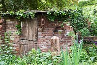 The World Horse Welfare Garden. Derelict stable with ivy growing over,  The World Horse Welfare Garden, RHS Chelsea Flower Show 2017