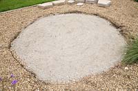 Foundation base for the circular patio of compressed finely crushed concrete 