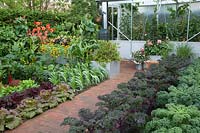 The Chris Evans Taste Garden - View of greenhouse and Brassica beds - RHS Chelsea Flower Show 2017