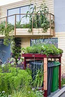 Greening Grey Britain Garden with  vegetables in containers on balcony, and living roof bin store - RHS Chelsea Flower Show 2017 - RHS Chelsea Flower Show 2017