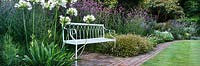 Mixed planting and bench seat, The Lost Gardens of Heligan, Cornwall