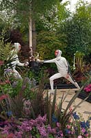 Two British Olympic Team fencers duel on pathway with borders, Duel and the Crown, RHS Chelsea 2012.