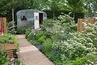 Brick paving with mixed herbaceous borders, A Celebration of Caravanning, RHS Chelsea 2012.