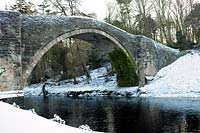 The Auld Brig O'Doon, River Doon, Burns National Heritage Park, Alloway, Ayr, Scotland, January.