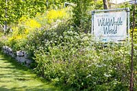 Wild flowerborder with sign of Wilde Weelde Wereld