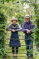 Sue Roe and her husband, Clive Lloyd, in their long town garden.