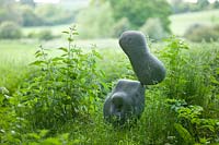 Meadow garden with modern sculpture - Asthall Manor, Oxfordshire
