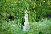 Meadow garden with modern sculpture - Asthall Manor, Oxfordshire