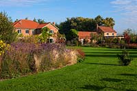 Lawn and border with houses in background