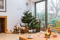 Tiered Christmas tree winter scene in living room