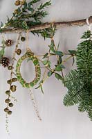 Branch decorated with stars, wreath and foliage