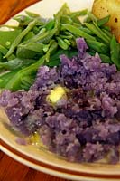 Mashed Solanum tuberosum 'Salad Blue' Potato with runner beans