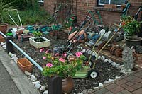 Front garden display of old lawnmowers, St Thomas, Exeter