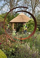RHS Chelsea Flower Show. Build up - team creating the garden. The M and G Centenary Garden 'Windows Through Time'.