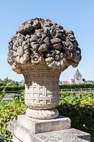Carved stone ornamental basket of flowers in the gardens at the Chateau de Villandry, Loire Valley, France.