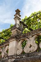 A stone balustrade in the gardens at the Chateau de Villandry, Loire Valley, France. A UNESCO World Heritage Site