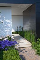 Contemporary garden with rectangular black and white pavilion RHS Hampton Court Show