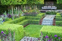 Support, The Husqvarna Garden. RHS Chelsea Flower Show 2016. Designer: Charlie Albone. Clipped Buxus hedges and sunken lawn.