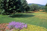 Lawn blending into natural meadow pasture Schupf Garden New York State Design by Oehme Van Sweden