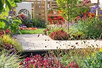 Perennial garden with terrace in the summer