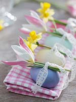colored with natural dyes eggs decorated with lace ribbon and flowers