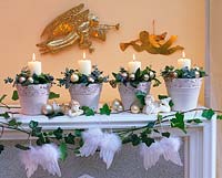 Unusual Advent wreath with four candles flower arrangements