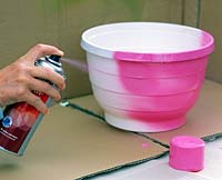Spray paintng a container pink