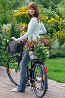 Young woman has bought a bike plant