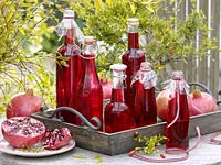 Home-made juice - syrup from pomegranate ( Punica ) bottled