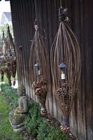 Lanterns in pastures hangers with cones of Pinus ( pine )