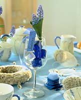 Easter table decoration with Muscari - name tag in the wine glass,