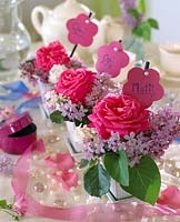 Table decoration - rose petals, Syringa vulgaris - lilac with name