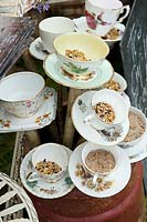 Tea cups with bird food