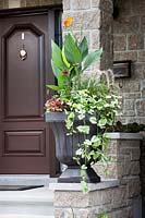 House entry with plant container