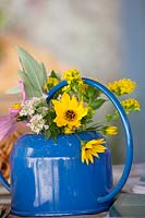 Bouquet with fall flowers in watering can